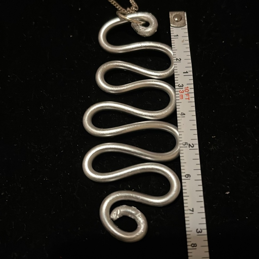 Elegant Silver Wave Hand Design Necklace - Picture 16 of 17